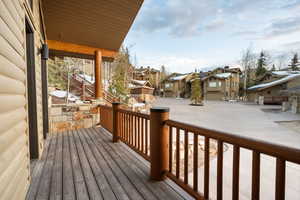 Wooden deck with a residential view