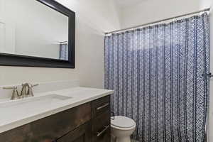 Bathroom featuring vanity and a shower with shower curtain