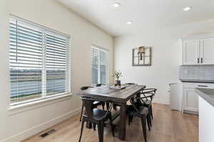 Dining space featuring light wood-style floors and recessed lighting