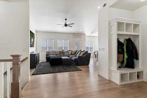Living area featuring light wood finished floors, ceiling fan, and recessed lighting