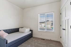 Sitting room with carpet flooring and baseboards