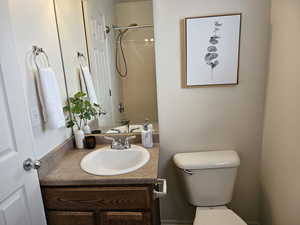 Full bath featuring vanity and shower / bath combination