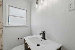 Bathroom featuring vanity and toilet