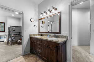 Full bath featuring light carpet, double vanity, and recessed lighting