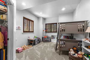 Bedroom with light colored carpet
