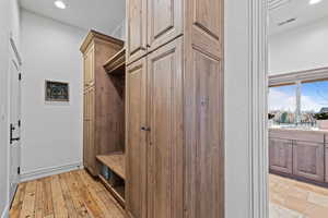 Mudroom featuring recessed lighting