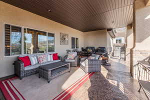 View of patio featuring outdoor furniture and a grill