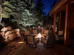 Patio at twilight with a patio area and a fire pit