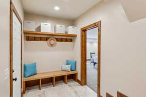 Mudroom with light carpet