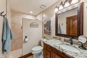 Full bath with vanity and a walk in shower