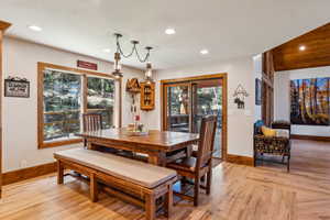 Dining area featuring light wood-style flooring, plenty of natural light, and recessed lighting