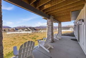 Fenced backyard with a mountain view, a patio, and a residential view