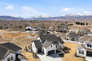 Aerial perspective of suburban area with a mountainous background