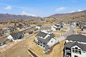 Aerial perspective of suburban area featuring a mountain backdrop