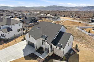 Aerial perspective of suburban area featuring a mountainous background