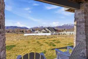 View of yard with a mountain view, a patio area, and a residential view