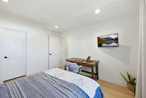 Bedroom featuring recessed lighting and light wood-style flooring