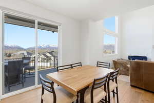 Dining space featuring light wood-style flooring and a mountain view