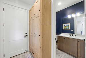 Bathroom featuring vanity and recessed lighting