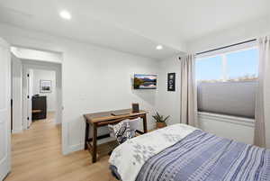 Bedroom featuring light wood finished floors and recessed lighting