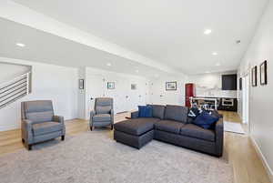 Living room featuring light wood-style floors and recessed lighting