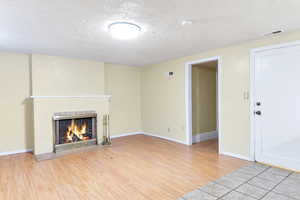 Basement apartment with a similar fireplace.