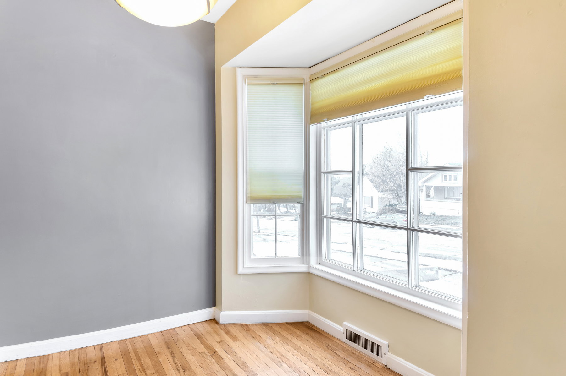 A cozy dining nook in the bay window is so inviting.