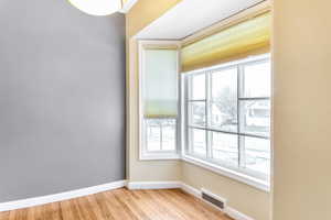 A cozy dining nook in the bay window is so inviting.
