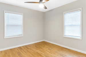 Bedroom with light wood floors.