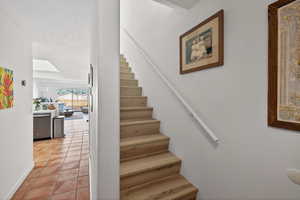 Stairway featuring tile patterned flooring