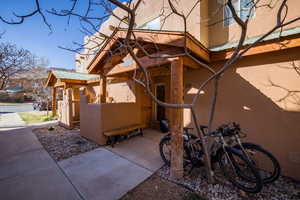 View of home's exterior with stucco siding and a metal roof