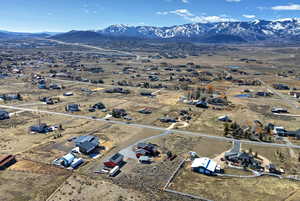 View of property location with mountains and nearby suburban area