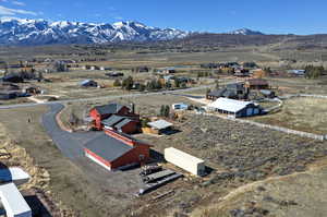 Aerial overview of property's location with mountains and rural landscape