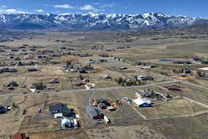 Aerial overview of property's location featuring a mountain backdrop