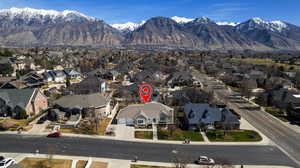 Aerial perspective of suburban area with a mountainous background