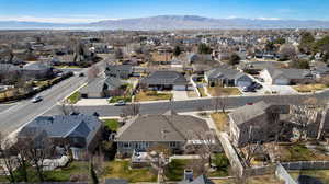 Aerial perspective of suburban area featuring a mountain backdrop