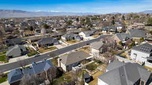 Aerial view of residential area featuring a mountainous background