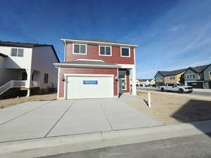 View of front facade featuring a residential view, an attached garage, driveway, and a shingled roof