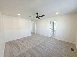 Empty room featuring recessed lighting, a ceiling fan, and light colored carpet