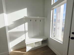 Mudroom featuring wood finished floors and baseboards