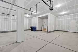 Garage featuring a garage door opener