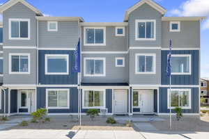 Contemporary house featuring board and batten siding and a residential view