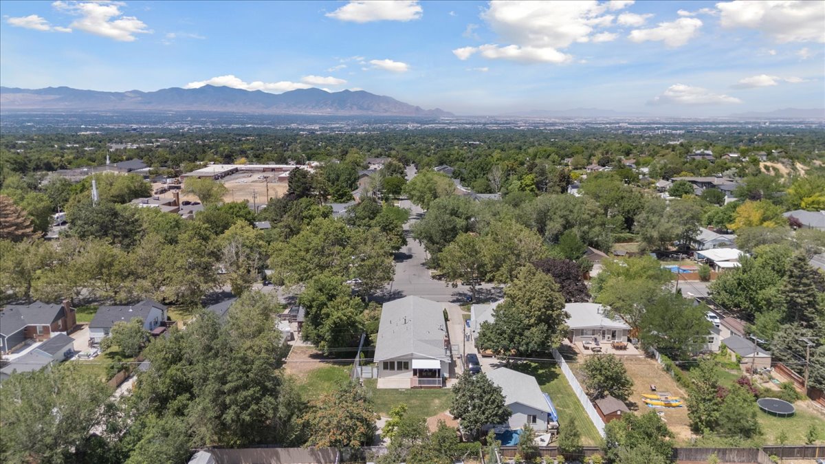 Aerial view of residential area featuring a mountain backdrop