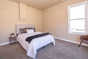 Carpeted bedroom with baseboards