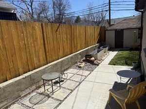 Fenced backyard featuring a patio area