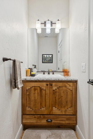 Bathroom with vanity and baseboards