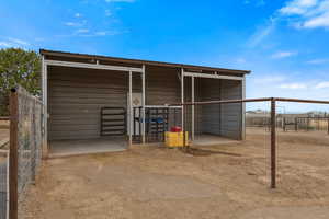 View of outbuilding with an exterior structure