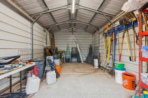 Garage featuring metal wall