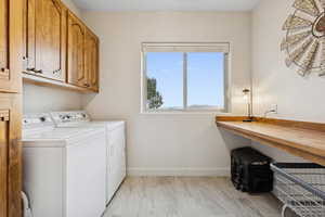 Laundry room with washer and dryer and cabinet space