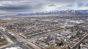 Aerial perspective of suburban area with a mountainous background